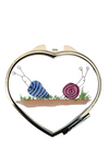 *Two snails heart compact mirror