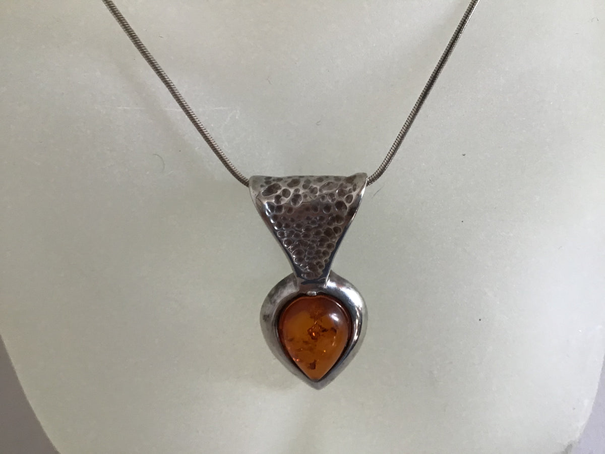 Hand hammered Silver 925 Amber and silver drop pendent on a sterling silver chain