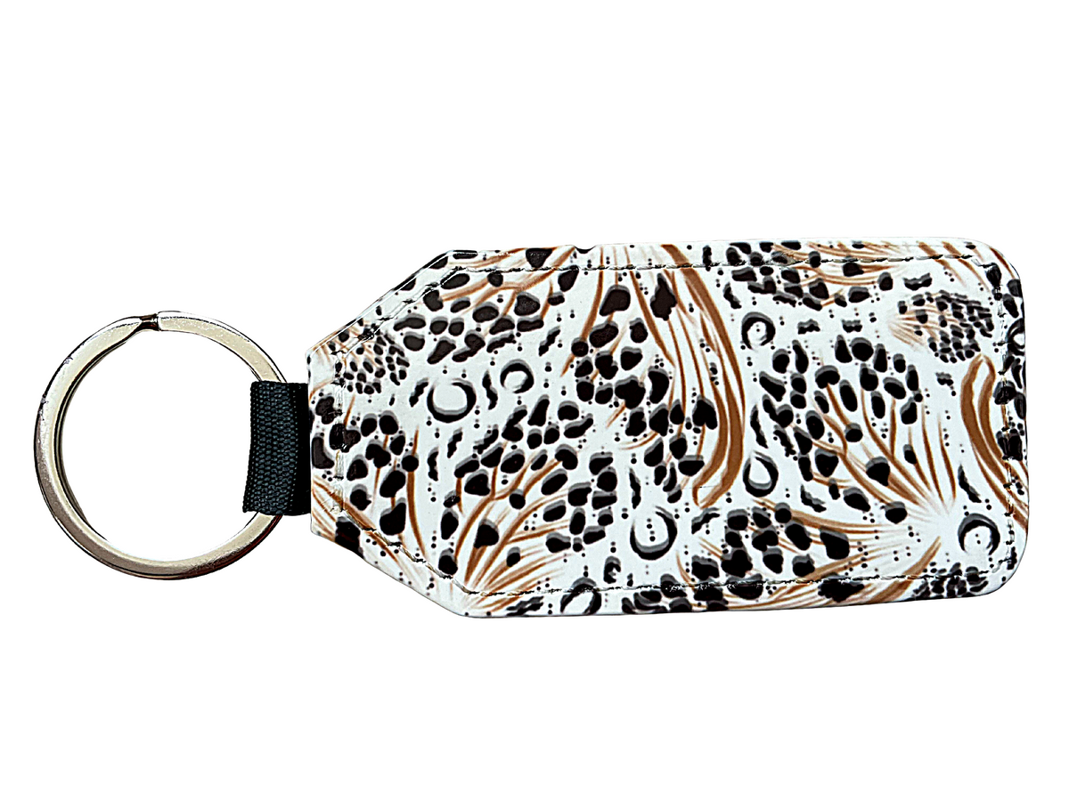 *Keyring in black, white and gold design