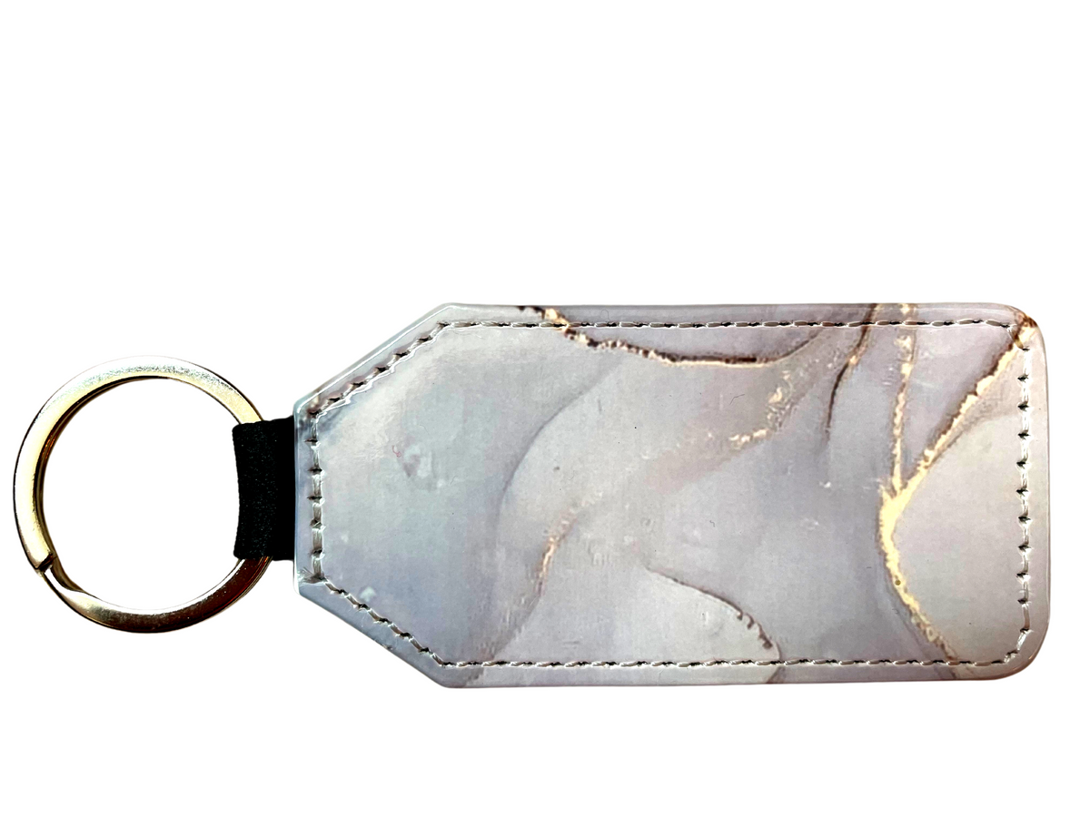 *Keyring with a white and gold marble design